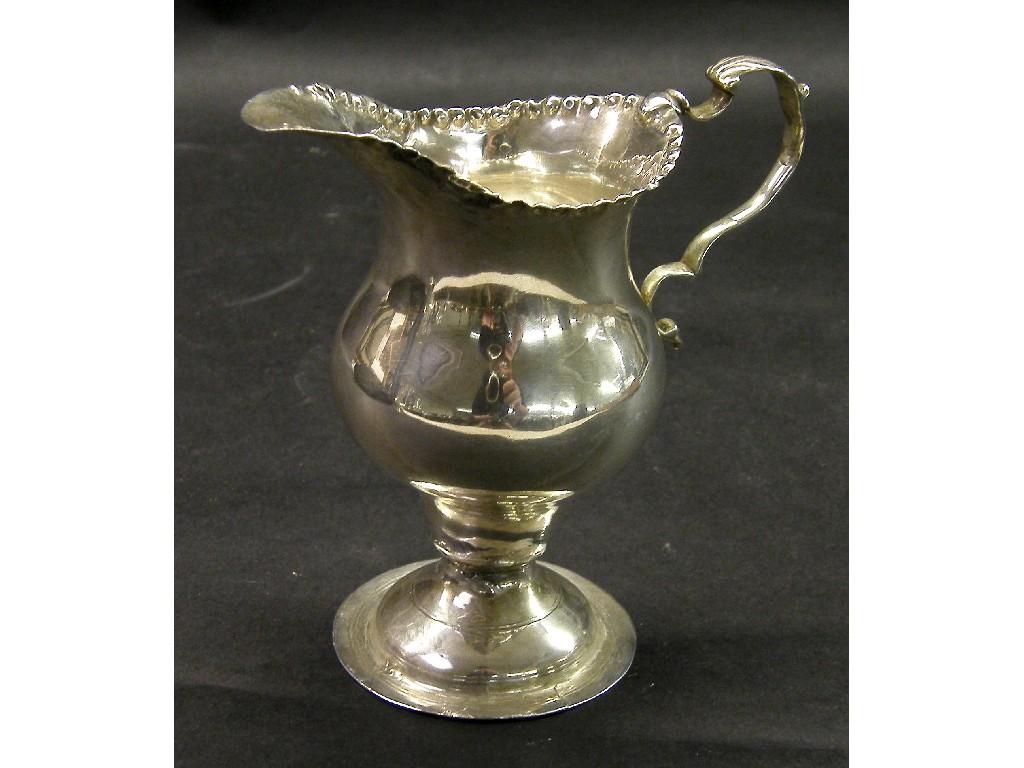 Appraisal: Georgian silver ovoid cream jug with crimped rim and C-scroll