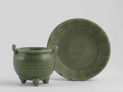 Appraisal: A Chinese celadon moulded brush washer and a small globular