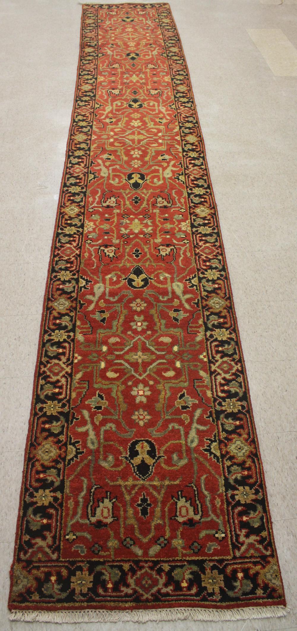 Appraisal: HAND KNOTTED ORIENTAL RUNNER Indo-Persian curvilinear design on rose ground