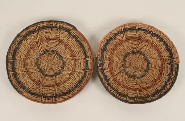 Appraisal: Pair African woven coil basket trays polychrome with raised petal