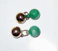 Appraisal: JADE CUFFLINKS A pair of double sided cufflinks one side