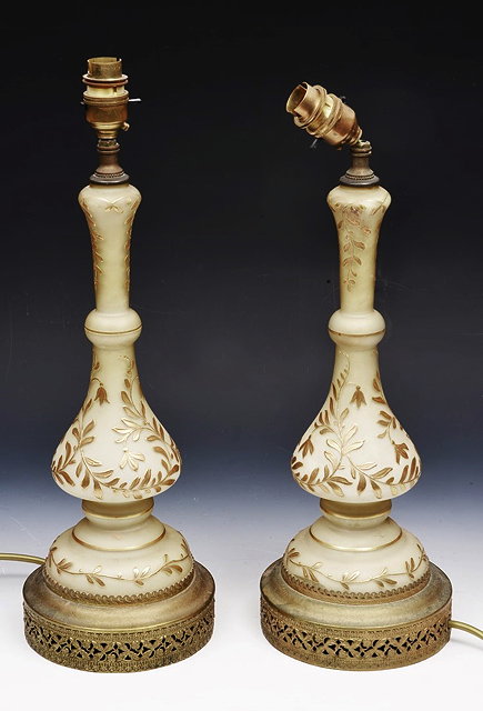 Appraisal: A PAIR OF CONTINENTAL OPAQUE GLASS TABLE LAMPS of baluster