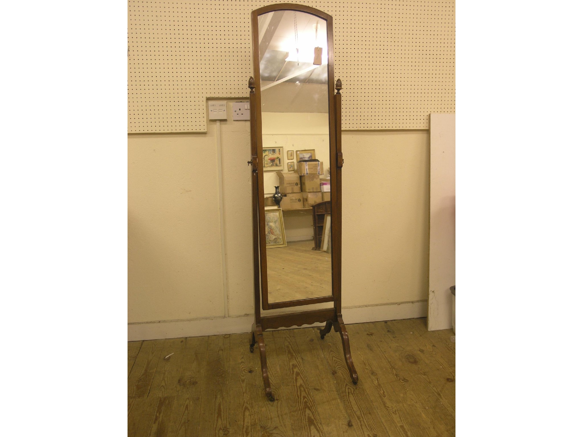 Appraisal: A mahogany cheval mirror on casters ft in