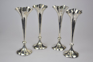 Appraisal: A set of four Edwardian silver specimen flute vases with