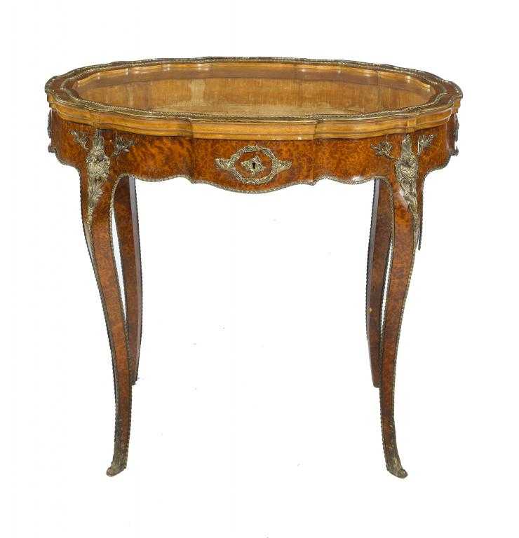 Appraisal: A VICTORIAN ORMOLU-MOUNTED AMBOYNA DISPLAY TABLE in Louis XV style