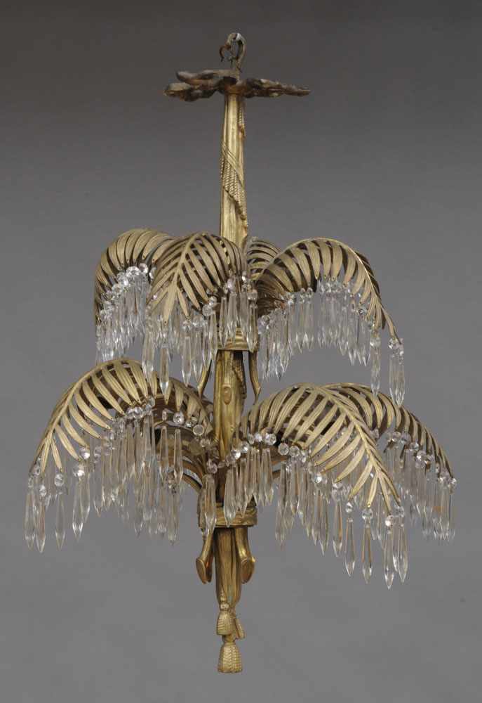 Appraisal: NAPOLEON III STYLE GLASS-HUNG GILT-METAL EIGHT-LIGHT CHANDELIER The bow-tied central