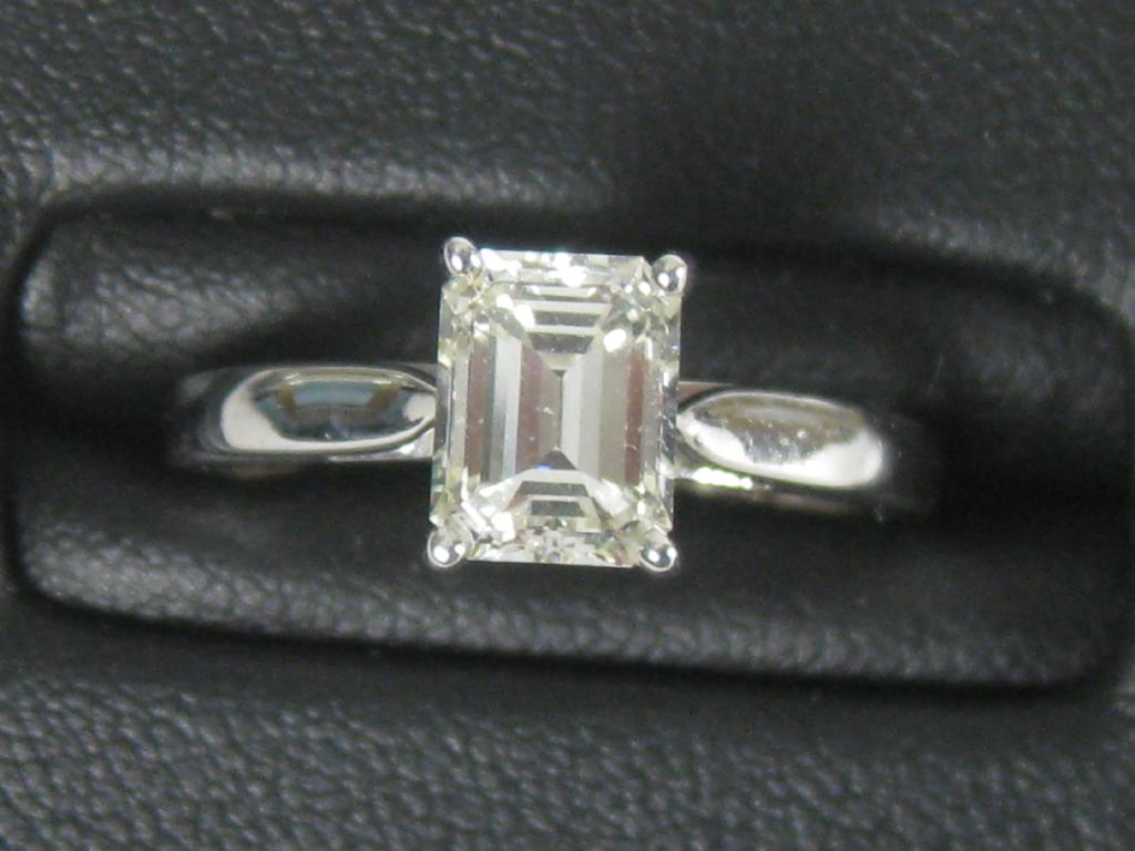 Appraisal: A Contemporary single stone Diamond Ring the step-cut stone approx