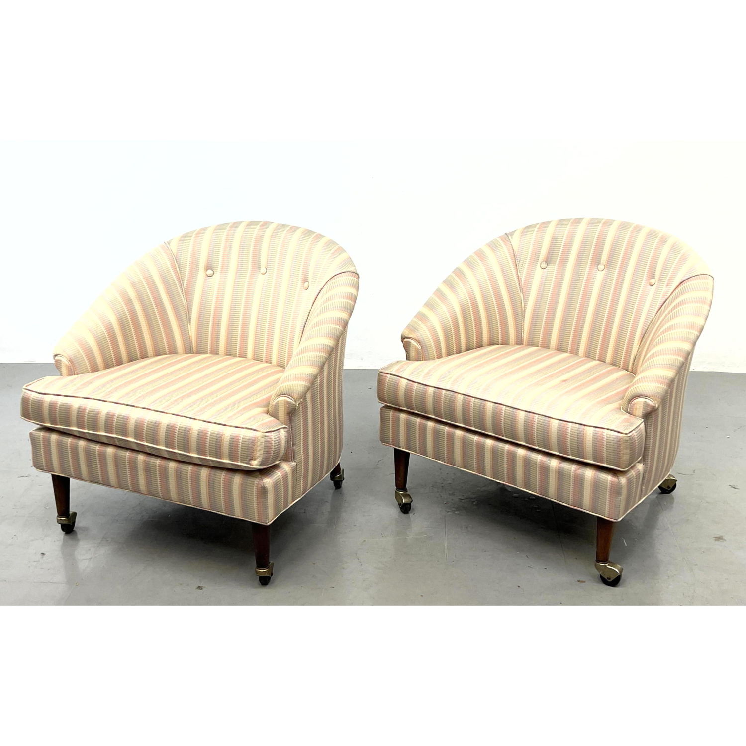 Appraisal: Pair Barrel Back Lounge Chairs on castors with walnut legs