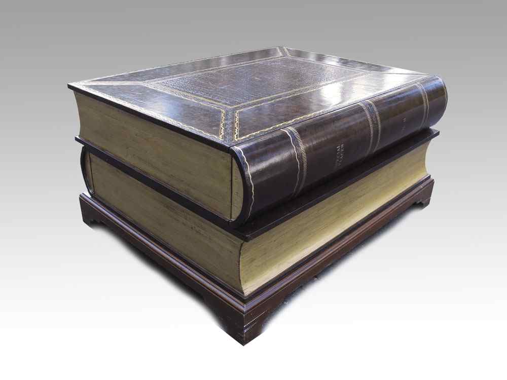 Appraisal: LEATHER COVERED STACKED BOOK COFFEE TABLE Coffee table in the