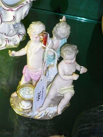 Appraisal: A MEISSEN PORCELAIN GROUP of three putti set against a