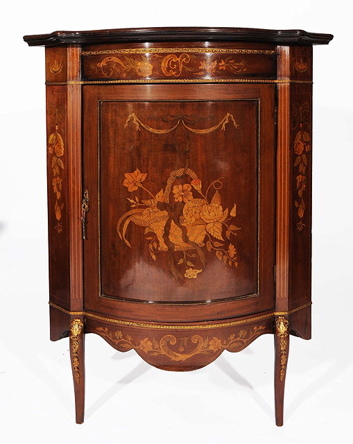 Appraisal: AN EDWARDIAN MAHOGANY AND MARQUETRY INLAID CORNER CUPBOARD with floral