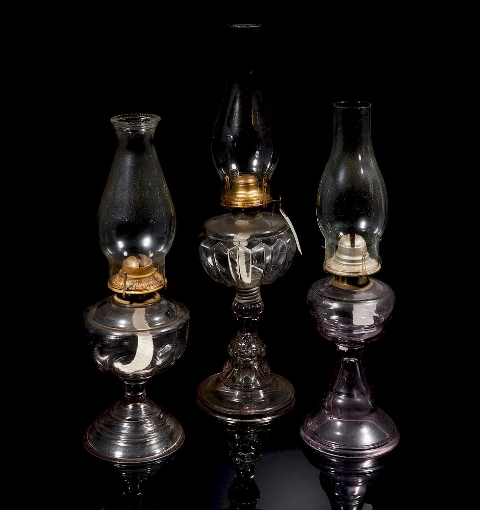 Appraisal: Three Glass Oil Lamps Three large glass oil lamps Dimensions