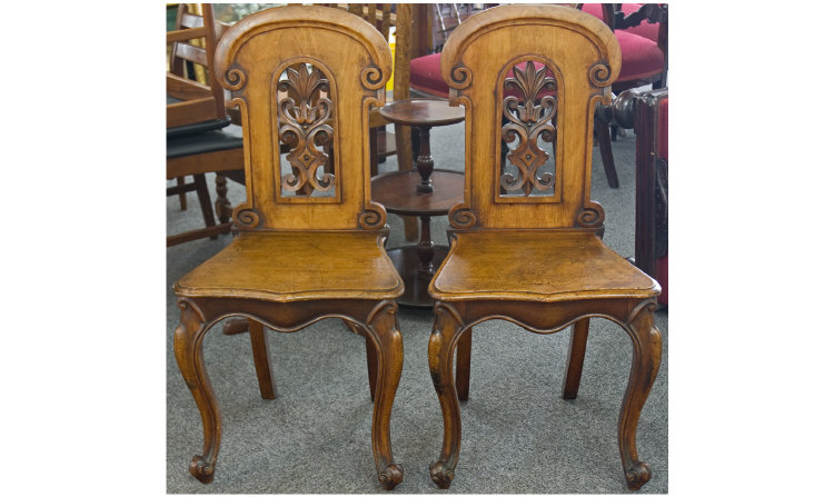 Appraisal: Pair of Victorian Oak Hall Chairs With carved and pierced