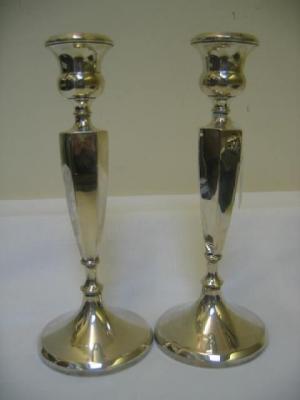 Appraisal: A PAIR OF CANDLESTICKS the urn sconce on tapering panelled