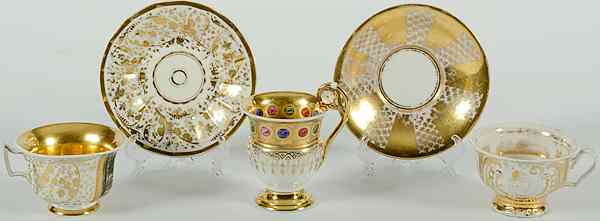 Appraisal: Continental Porcelain Gilded Cups Continental five porcelain gilded tablewares including