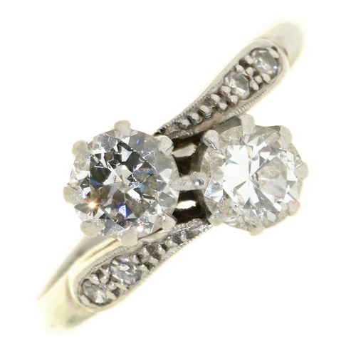 Appraisal: A diamond crossover ring with diamond set shoulders in platinum