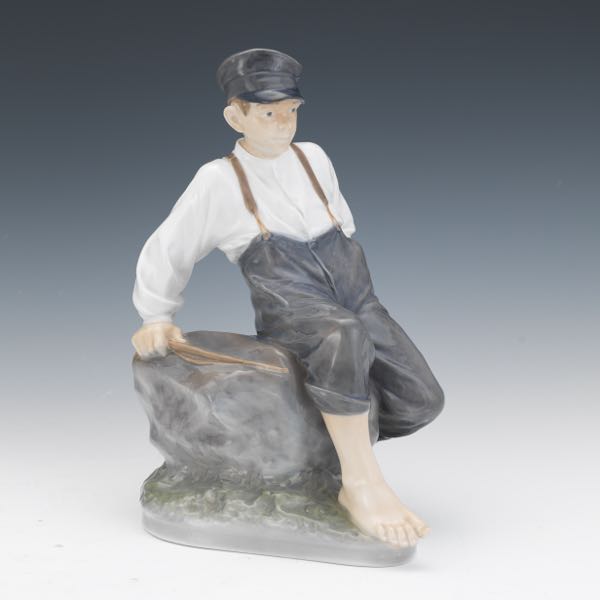 Appraisal: ROYAL COPENHAGEN SHEPHERD BOY ON ROCK FIGURINE x x Royal