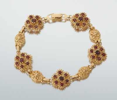 Appraisal: A Ladies' Garnet Bracelet k yellow gold bracelet with open