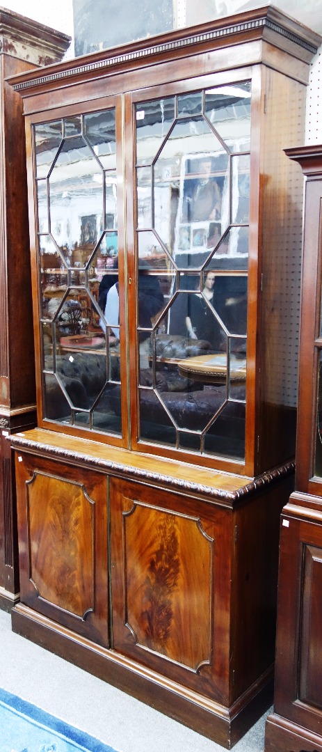 Appraisal: A George III and later mahogany display cabinet cupboard the