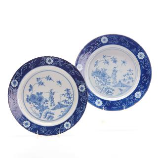 Appraisal: Pair antique Delft blue white pottery chargers Pair antique Delft