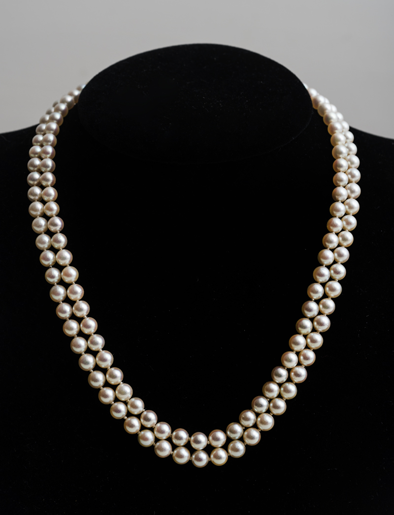 Appraisal: CARTIER DOUBLE STRAND PEARL AND K GOLD NECKLACE Signed 'Cartier