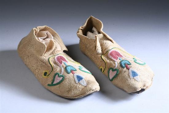 Appraisal: PAIR BLACKFOOT BEADED BUCKSKIN MOCCASINS early th century Floral decoration