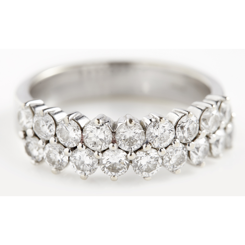 Appraisal: A diamond set half eternity ring claw set with two