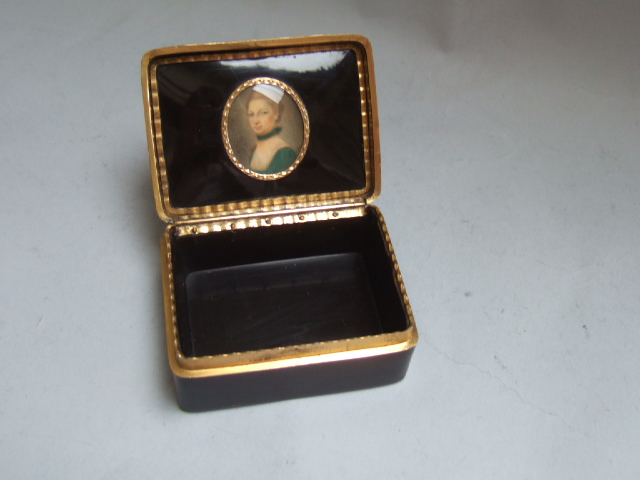 Appraisal: A gilt metal mounted rectangular tortoiseshell hinge lidded box fitted