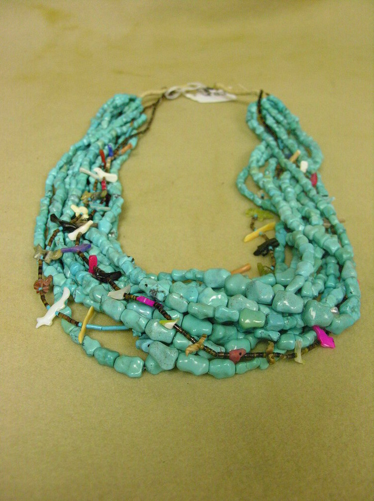 Appraisal: NATIVE AMERICAN TURQUOISE AND FETISH NECKLACE necklace that has strands