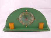 Appraisal: A mains electric Art Deco mantel clock a semi circle