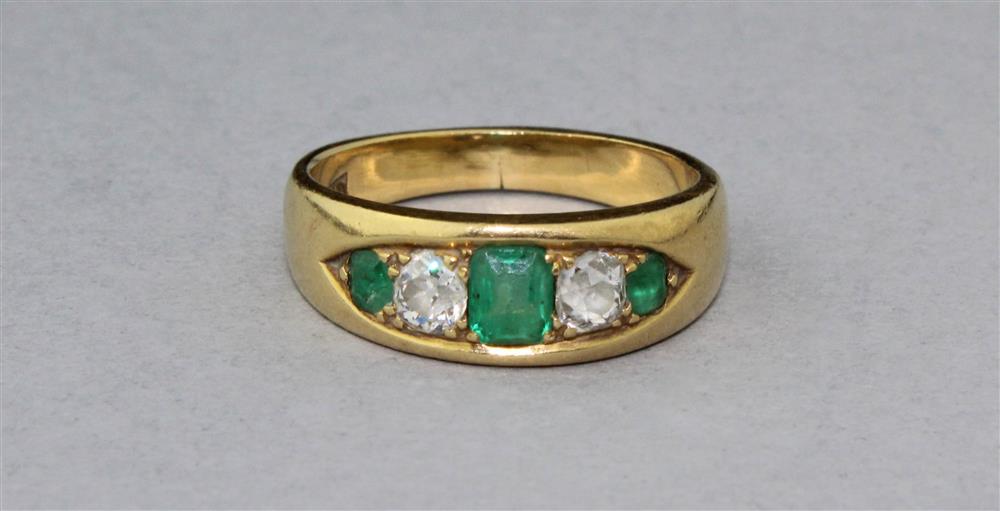 Appraisal: K YELLOW GOLD EMERALD AND DIAMOND RING the center emerald