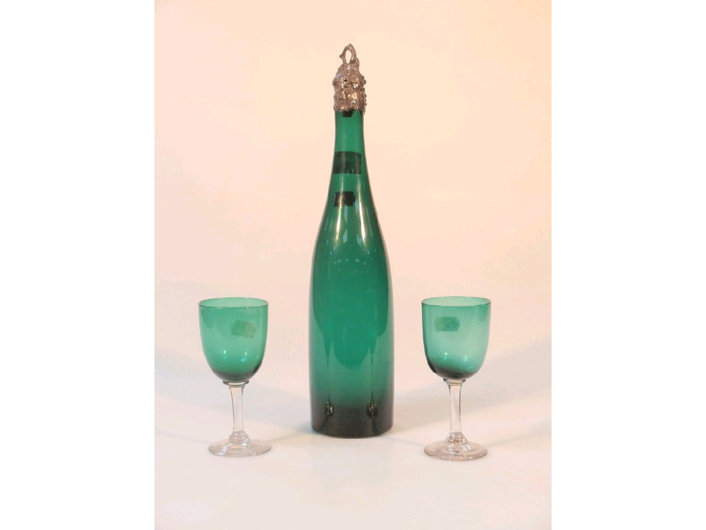 Appraisal: A Victorian emerald green glass bottle with a silver vine