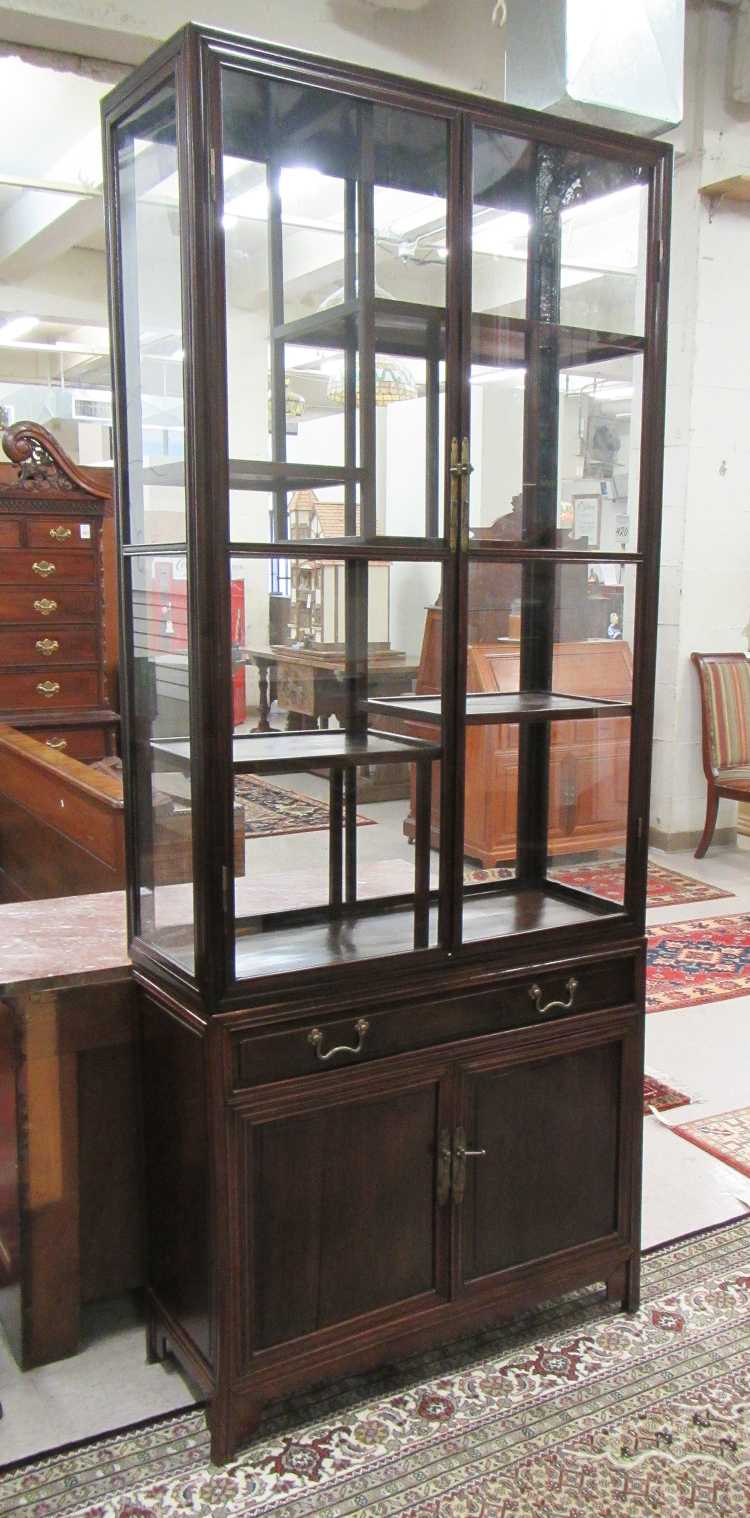 Appraisal: HONGMU AND GLASS CURIO CABINET ON CABINET Chinese th century