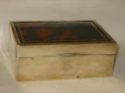 Appraisal: A CIGARETTE BOX of oblong form the tortoiseshell panelled lid