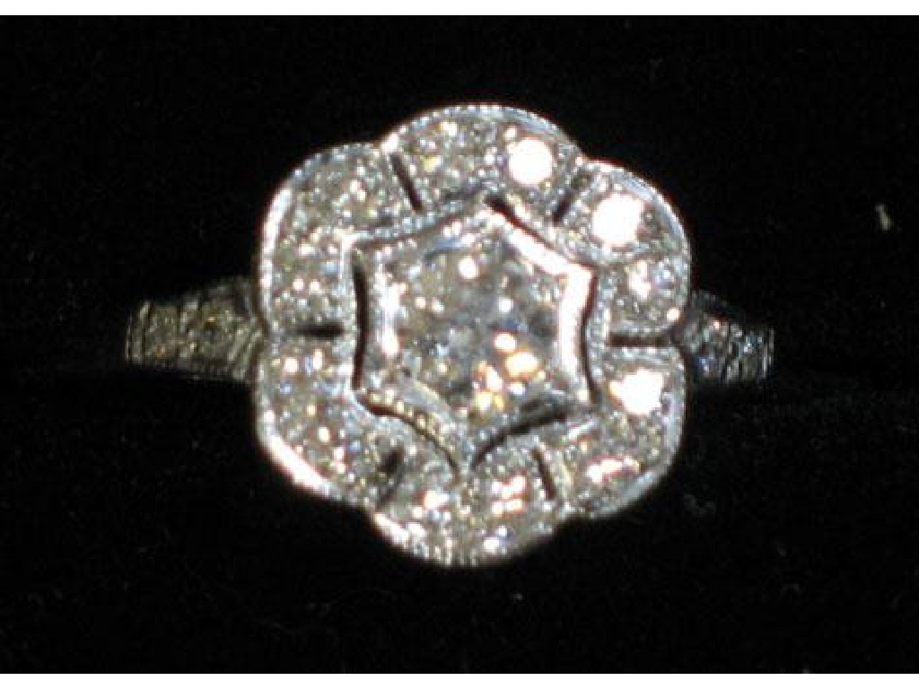 Appraisal: AN ART DECO STYLE DIAMOND RING the central round brilliant-cut