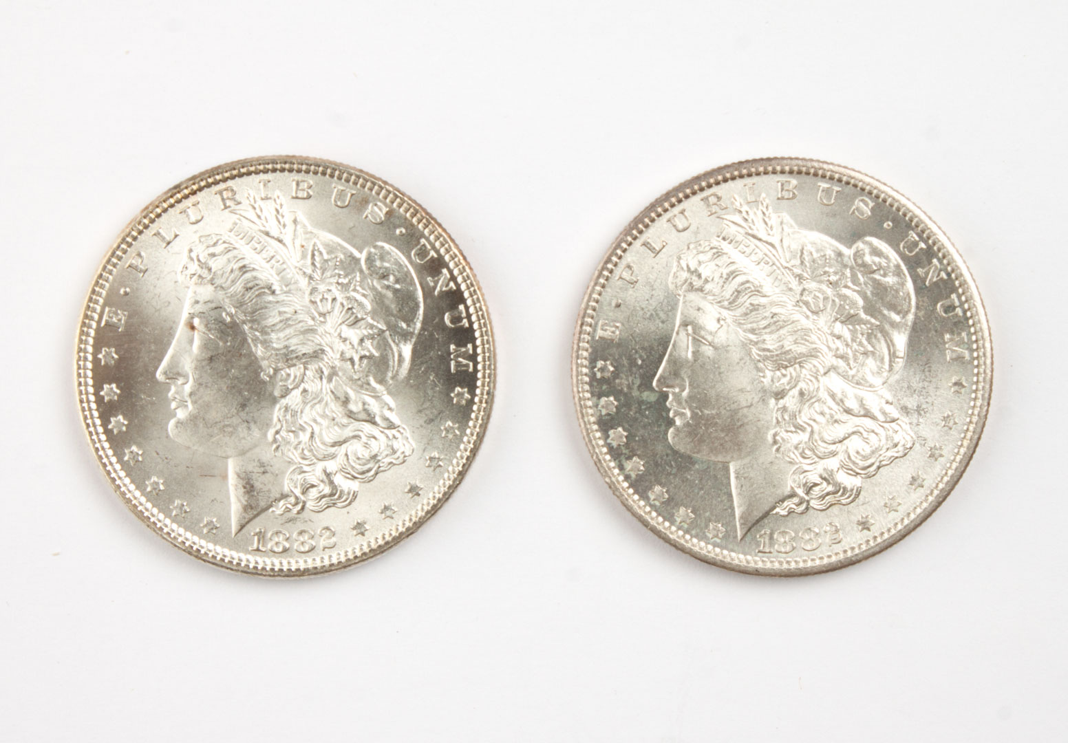 Appraisal: Two U S Morgan type silver dollars comprising MS- and