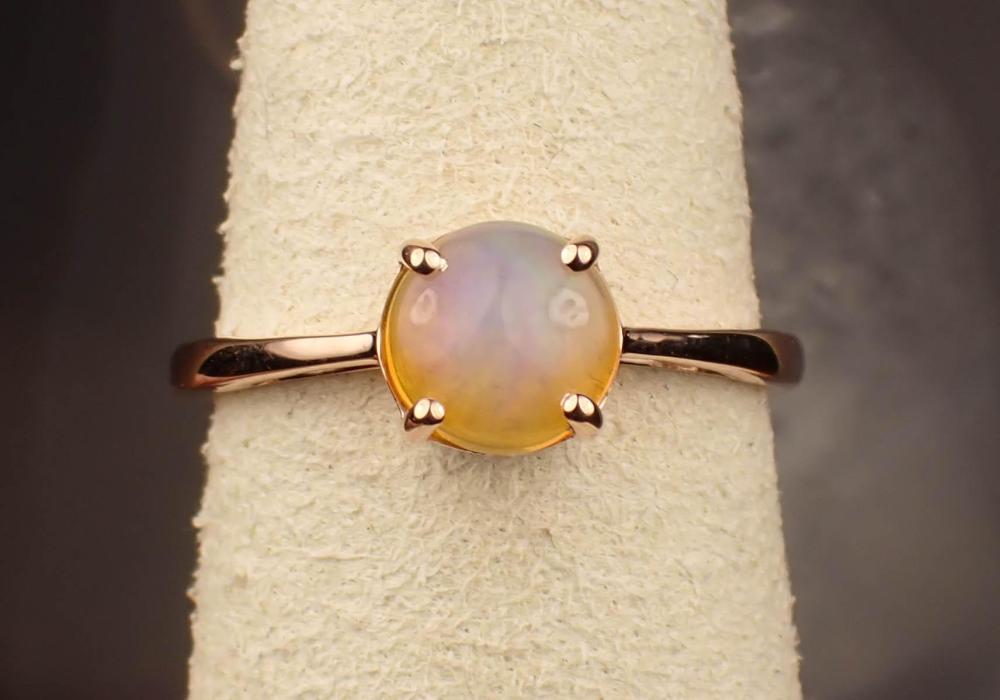 Appraisal: FIRE OPAL AND FOURTEEN KARAT ROSE GOLD RING with four