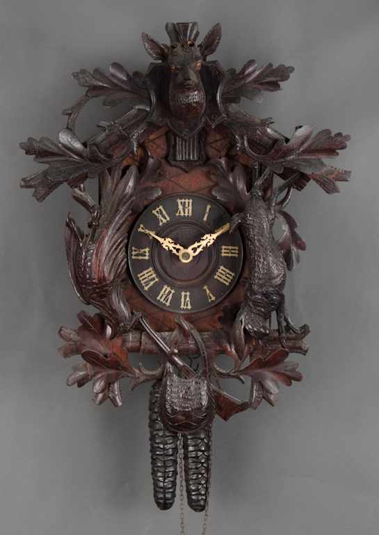 Appraisal: German carved wood hunters cuckoo clock early th century carved