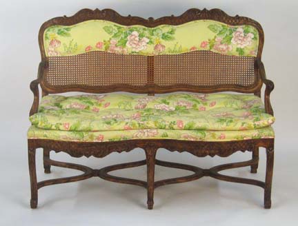 Appraisal: Louis XV style beech settee With a partial caned backrest