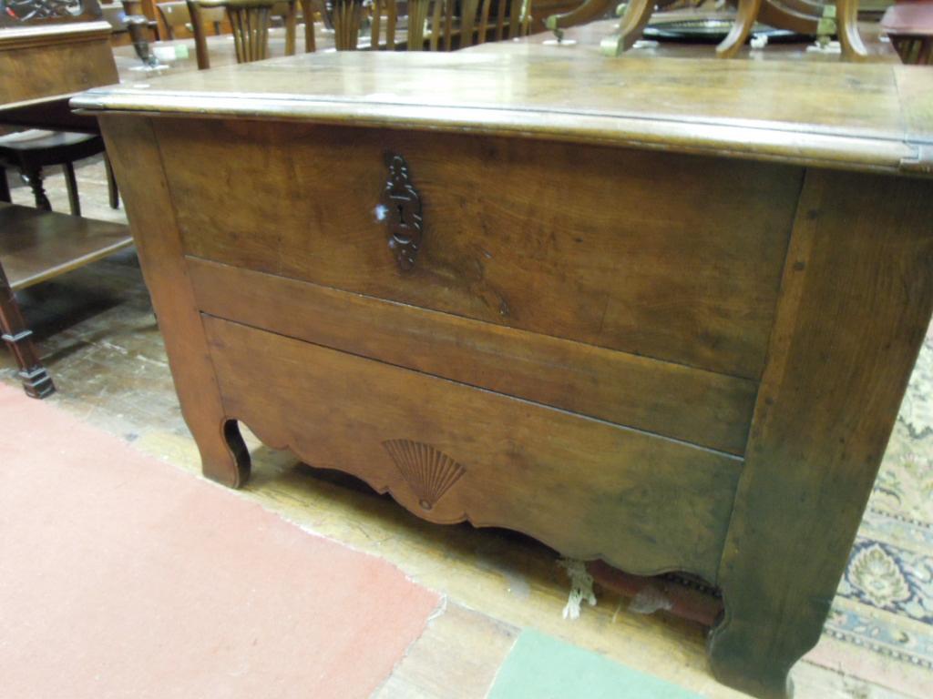 Appraisal: An antique continental oak coffer with steel lock plate and