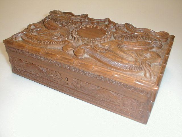 Appraisal: A carved teak box tin and ashtray