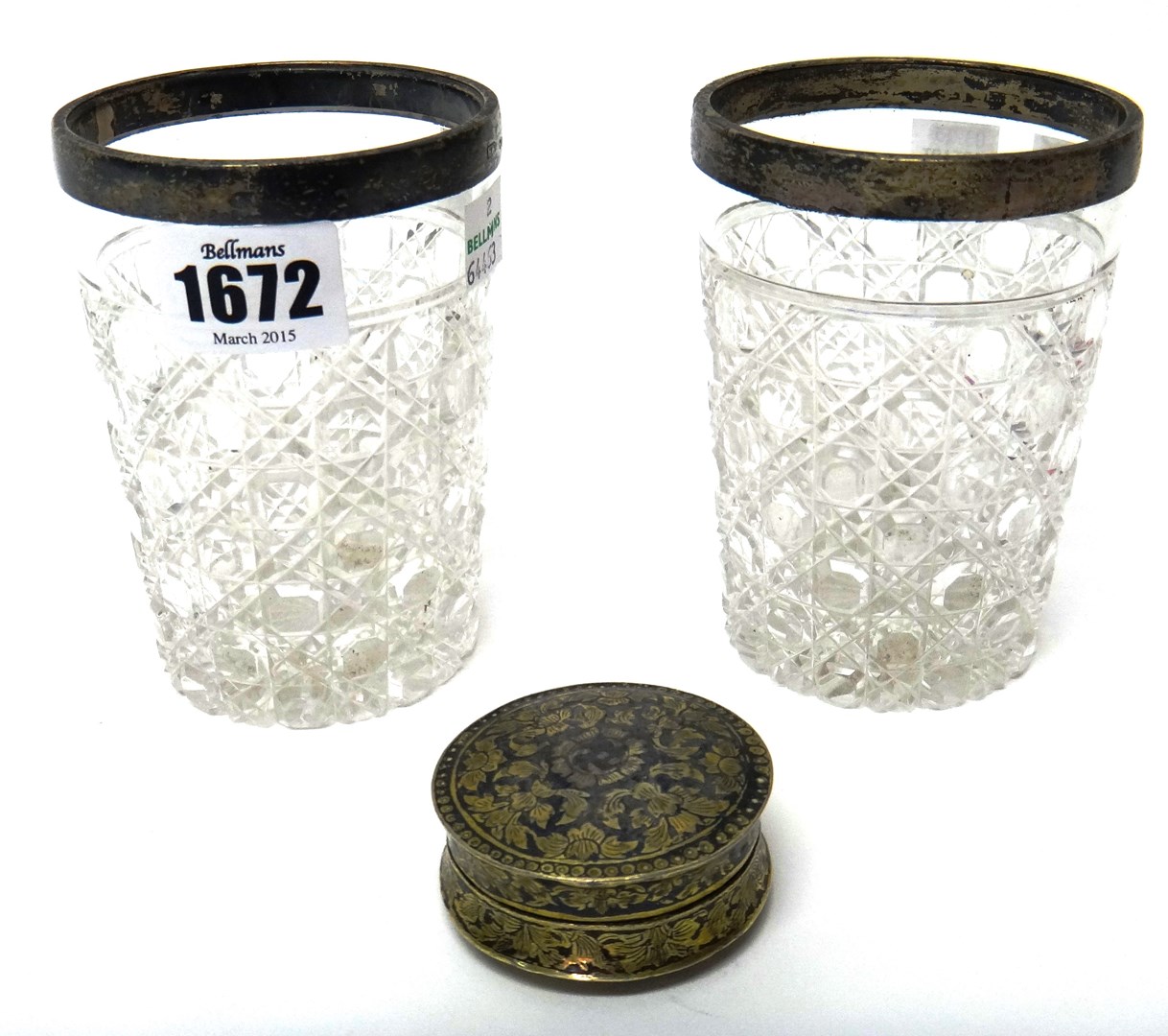 Appraisal: A pair of Victorian silver rimmed faceted glass vases each