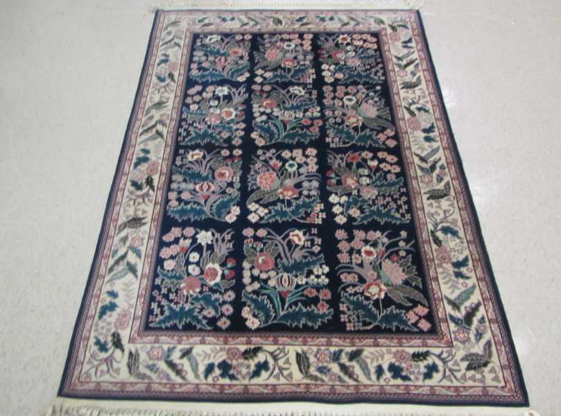 Appraisal: HAND KNOTTED ORIENTAL AREA RUG Sino-Persian repeating rectangular floral groups