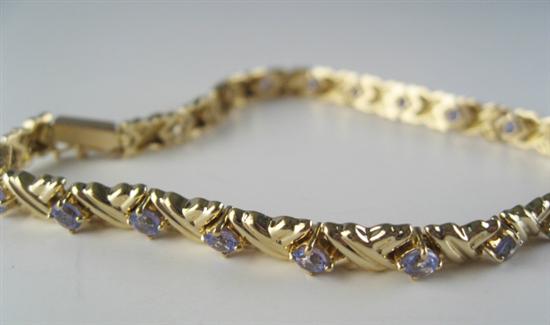 Appraisal: A Gold and Tanzanite Bracelet K marked yellow gold set