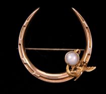 Appraisal: A Vintage Star Sapphire Gold Dragon Brooch A gold crescent