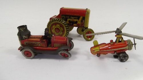 Appraisal: A tinplate clockwork helicoptor a tinplate fire engine and a