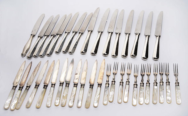 Appraisal: A QUANTITY OF SILVER HANDLED TABLE KNIVES with marks for