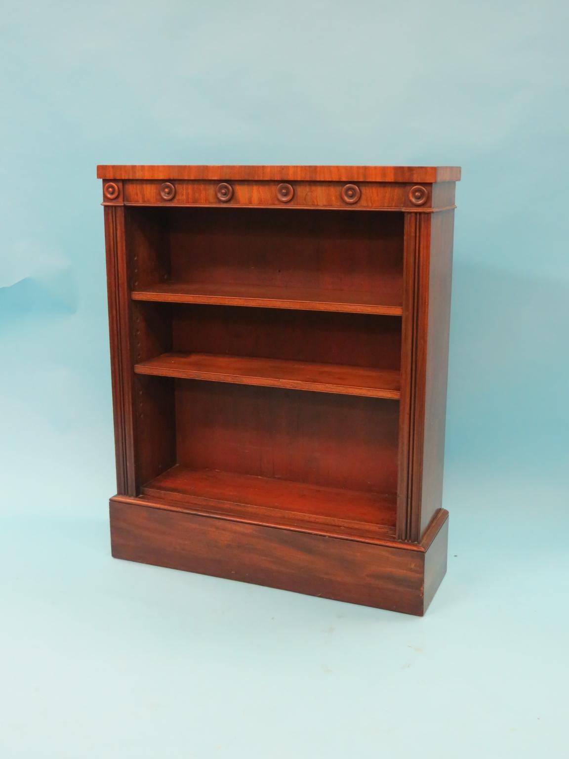 Appraisal: A William IV mahogany open bookcase frieze with applied roundels