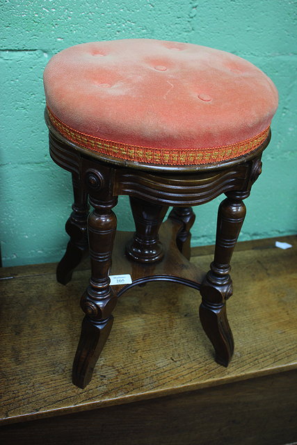 Appraisal: AN EDWARDIAN MAHOGANY REVOLVING PIANO STOOL with buttoned and upholstered