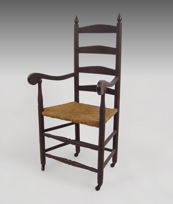 Appraisal: LATE 'S LADDERBACK CHAIR ON CASTERS splat back rush seat